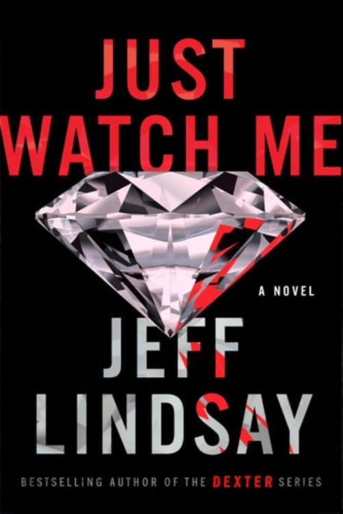 This image features the cover of the novel "Just Watch Me" by Jeff Lindsay, the bestselling author of the Dexter series. The cover design is bold and striking, prominently displaying a large, clear diamond in the center with the title "Just Watch Me" arched elegantly above it in red and white lettering.