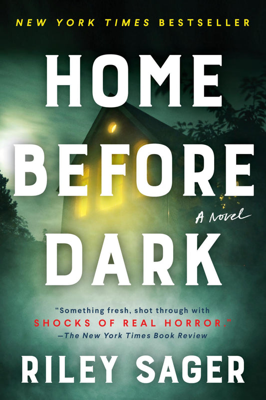 Book cover for the novel 'Home Before Dark' by Riley Sager, featuring large white title text over a dark green misty forest scene with a glowing yellow house window.