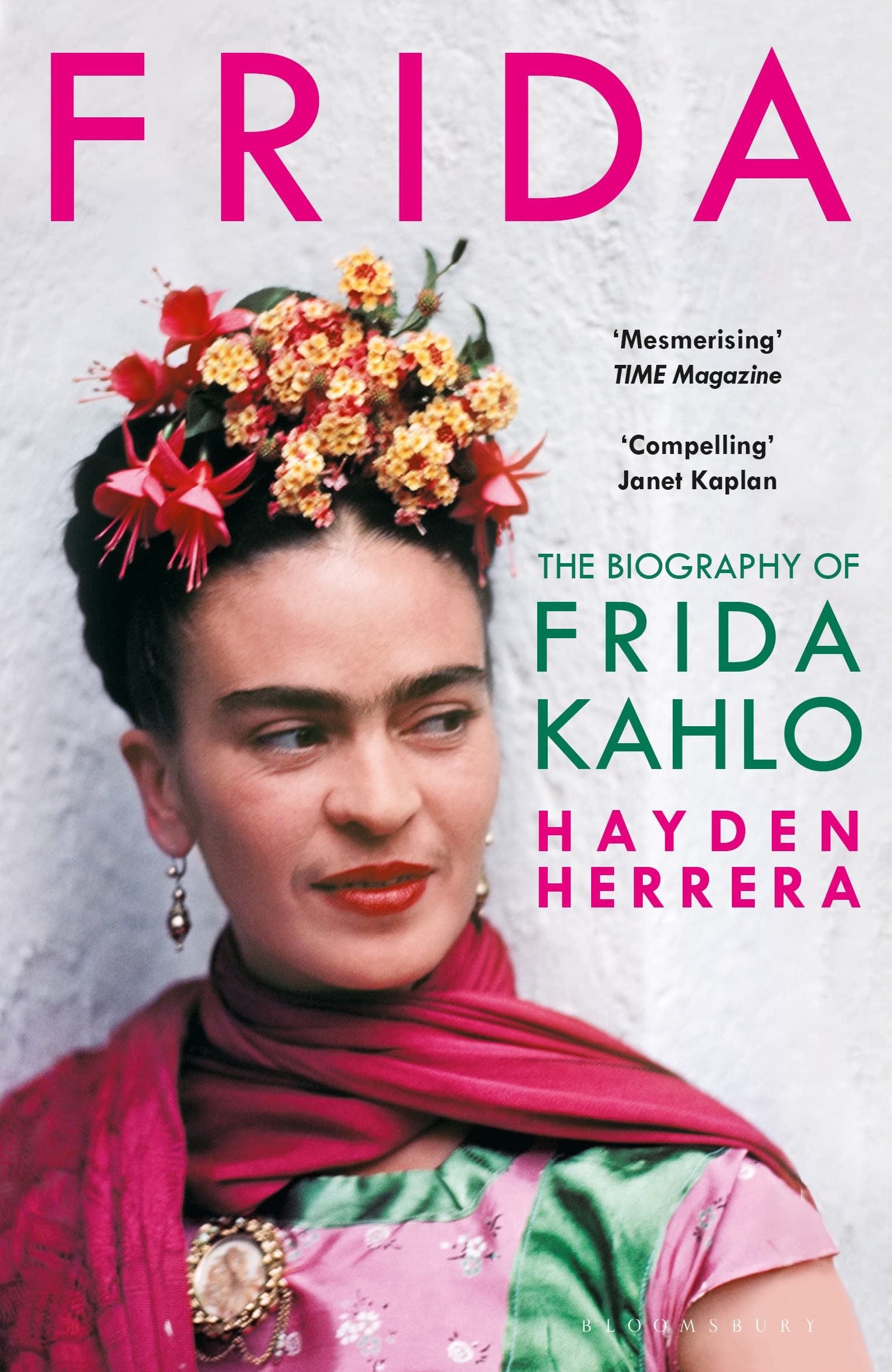 Book cover of 'Frida' by Hayden Herrera featuring a portrait of Frida Kahlo with flowers in her hair.