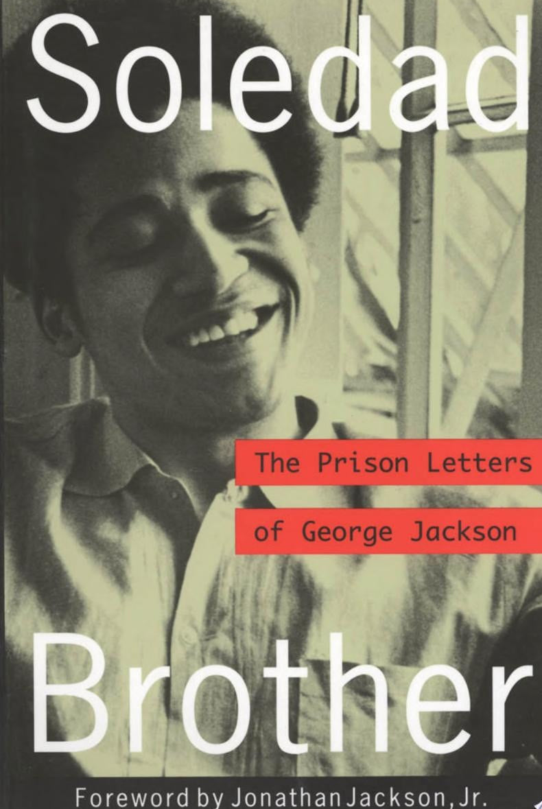 Book cover of 'Soledad Brother: The Prison Letters of George Jackson' with a black and white photo of a George Jackson incarcerated.