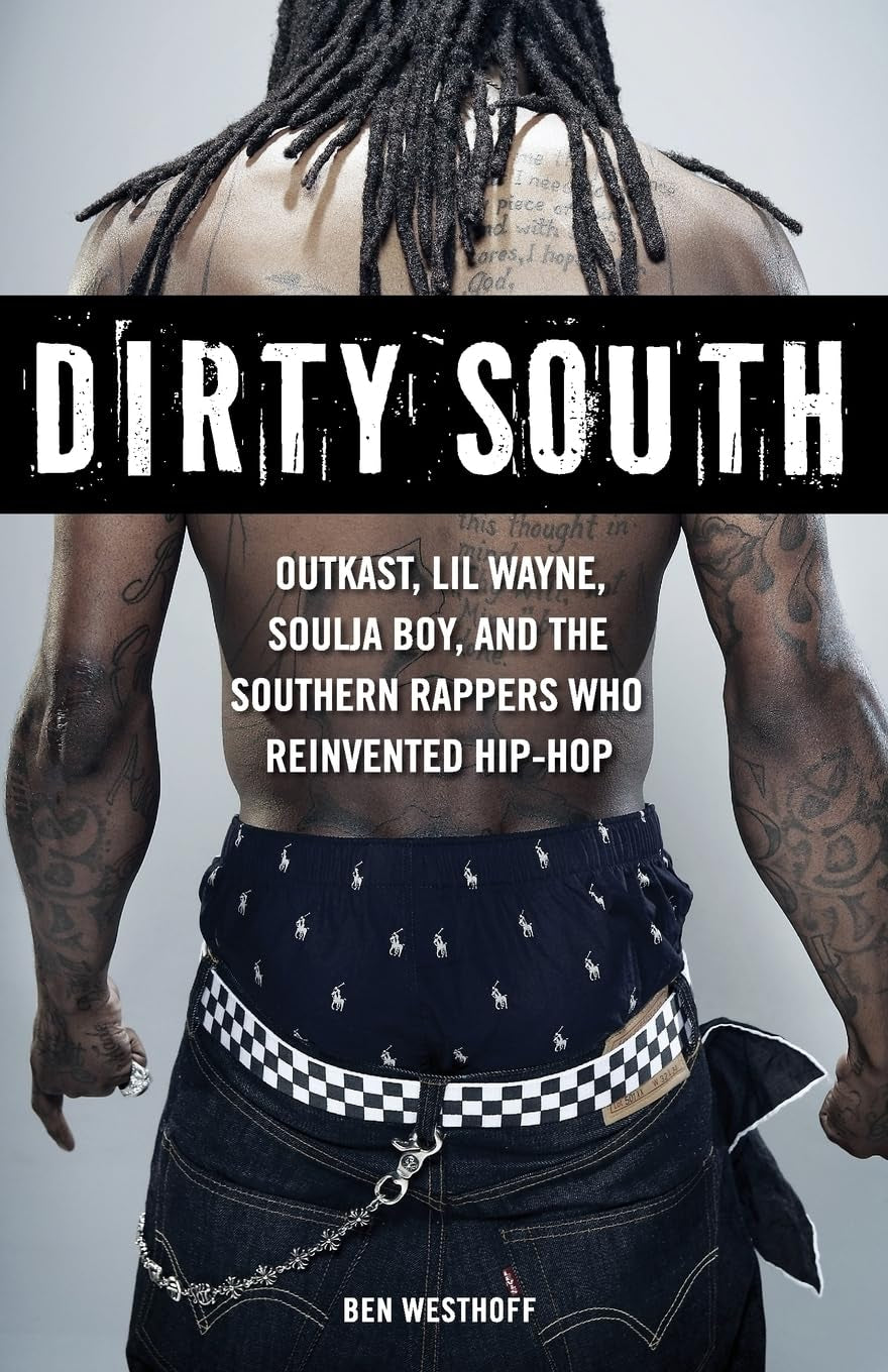 Book cover for 'Dirty South' by Ben Westhoff featuring a male model with a checkered belt and a black and white hairstyle, against a white background with the title text.