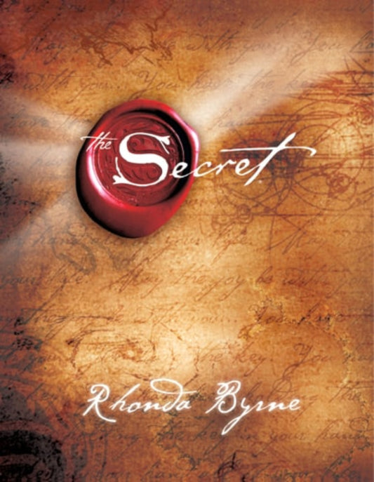 Cover of the book 'The Secret' by Rhonda Byrne, featuring a red wax seal stamp with the title written in white script on a textured, vintage-style background.