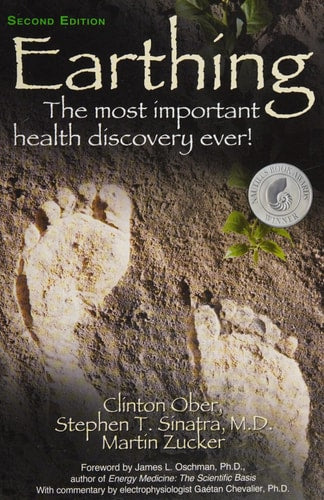 Book cover of 'Earthing' with footprints in sand and text about health benefits.