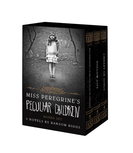 A boxed set of 'Miss Peregrine's Peculiar Children' books by Ransom Riggs, featuring three novels wrapped in black and brown book covers with a young girl's image on the cover of the first book.