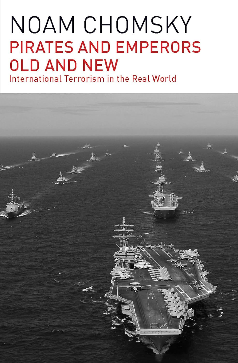 This image features the cover of the book "Pirates and Emperors, Old and New: International Terrorism in the Real World" by Noam Chomsky. The cover depicts a dramatic and striking scene of numerous battleships and aircraft carriers assembled in a vast ocean, under a dark, overcast sky.
