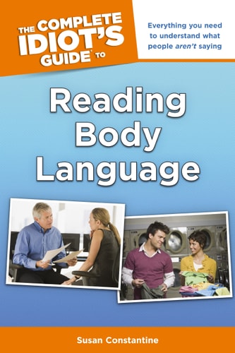 Book cover of 'The Complete Idiot's Guide to Reading Body Language' by Susan Constantine with two people interacting in a classroom setting.