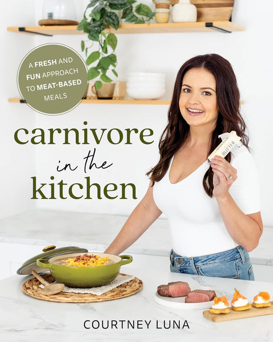 Book cover of 'Carnivore in the Kitchen' by Courtney Luna featuring a woman in a kitchen.