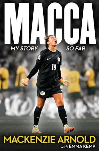Book cover for 'MACCA MY STORY SO FAR' by Mackenzie Arnold with Emma Kemp, featuring a photo of soccer player Macca in a black jersey celebrating on the field, with large white title text and yellow author text.