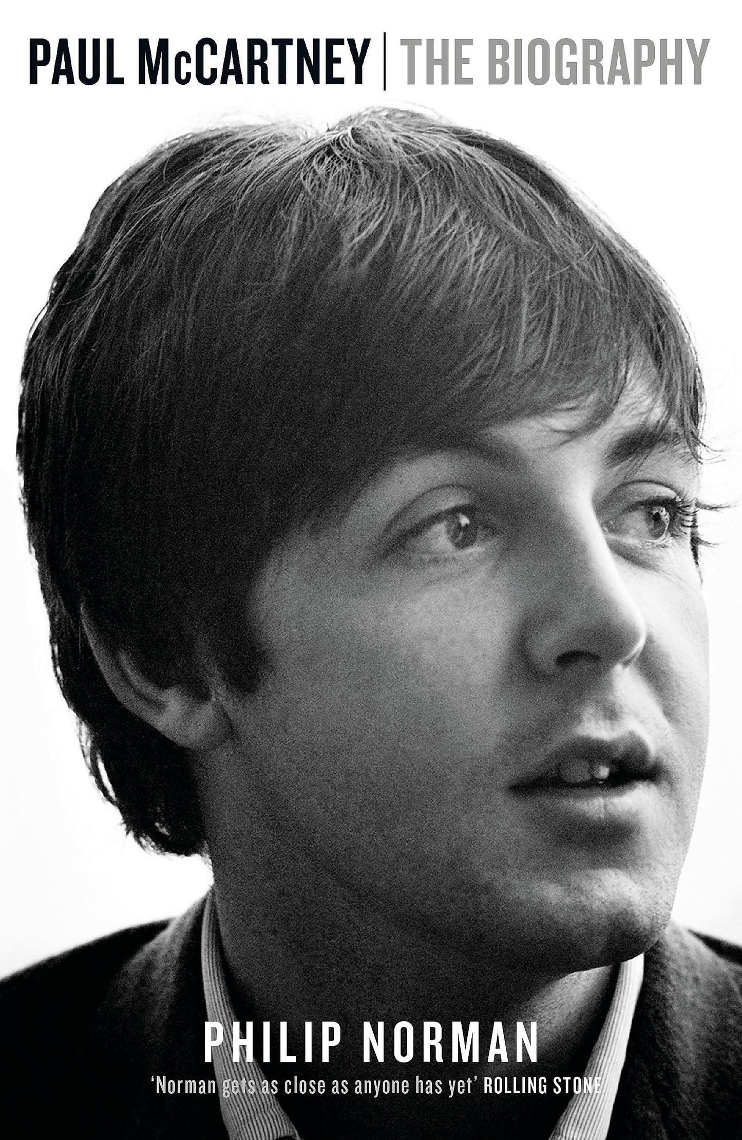 Book cover of 'Paul McCartney: The Biography' by Philip Norman with a black and white portrait of Paul McCartney.
