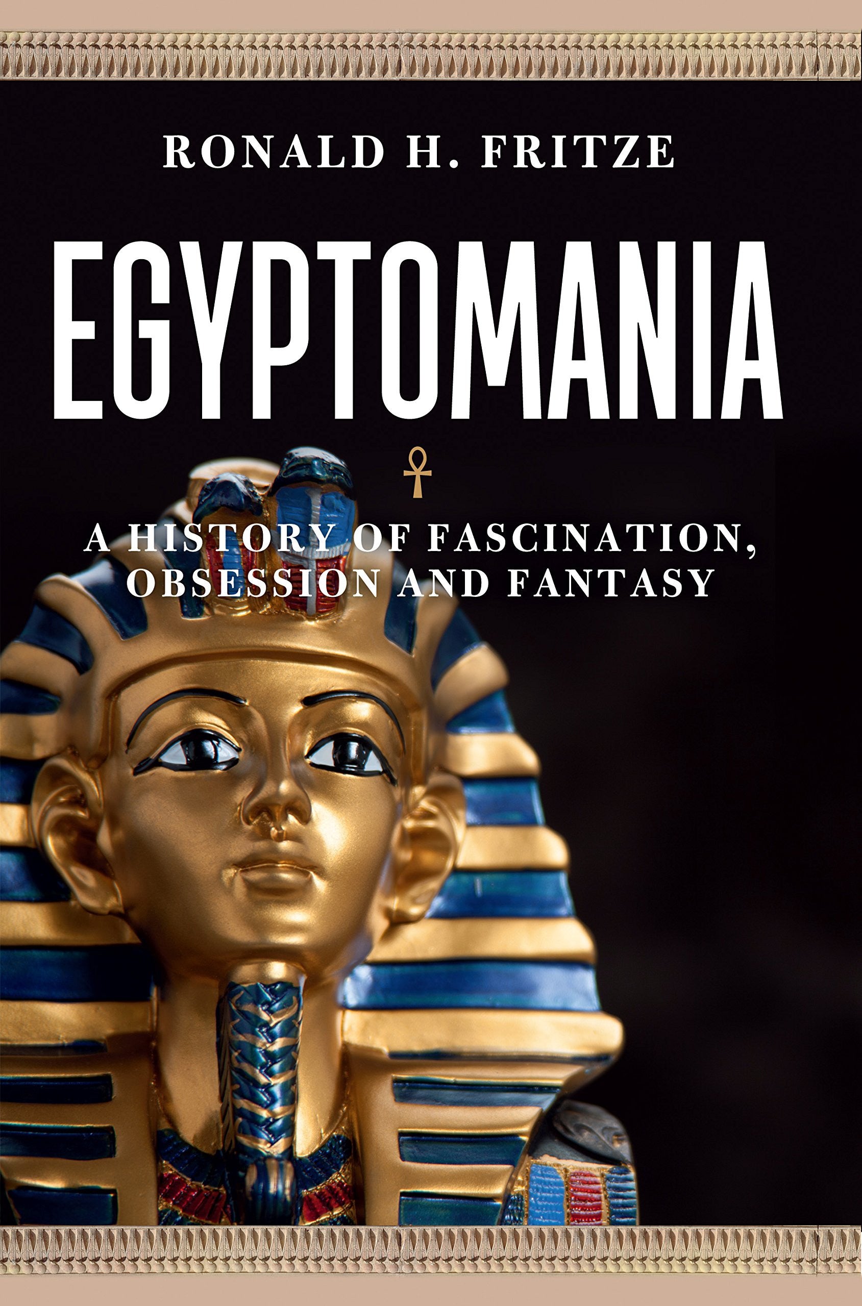 Book cover for 'Egyptomania: A History Fascination, Obsession and Fantasy' by Ronald H. Fritze, featuring a golden pharaoh mask with blue and gold details against a dark background.