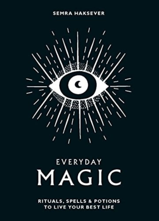 Book cover of 'Everyday Magic: Rituals, Spells & Potions to Live Your Best Life' featuring a stylized eye with rays and text.