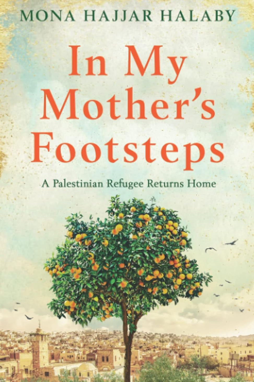 Book cover of 'In My Mother's Footsteps' featuring a tree with fruit and birds in the background, with the author's name and the title in the foreground.