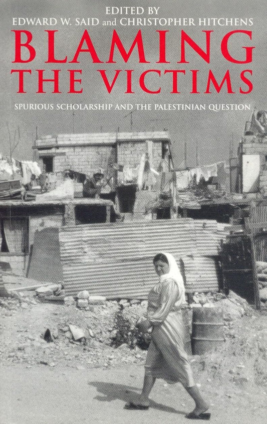 Book cover of 'Blaming the Victims: Spurious Scholarship and the Palestinian Question' by Edward W. Said and Christopher Hitchens, showing a black and white photo of a woman walking in a destroyed city, with the editors' names at the top.