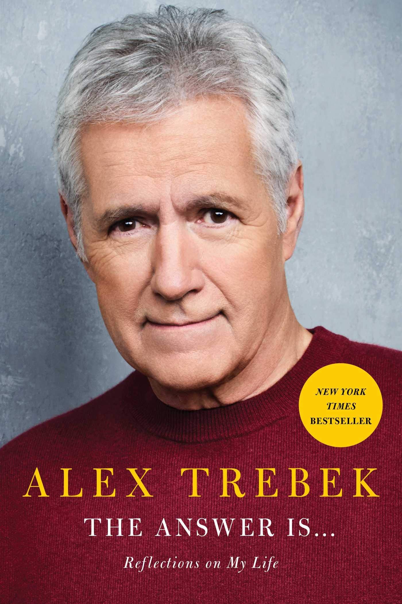 Book cover of 'The Answer Is: Reflections on My Life' by Alex Trebek, featuring Trebek in a red sweater with a gray background.