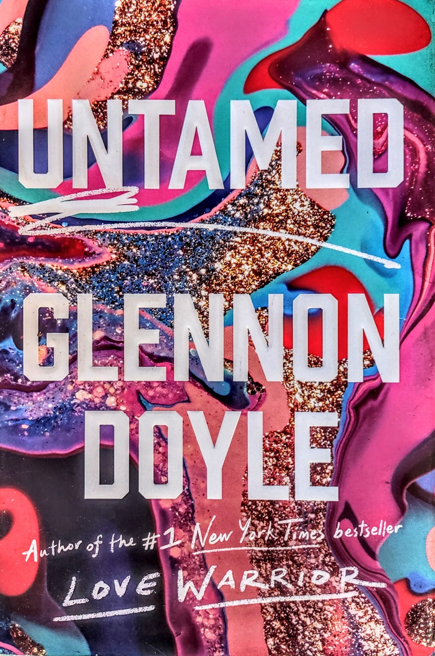 Book cover of 'Untamed' by Glennon Doyle with colorful abstract design
