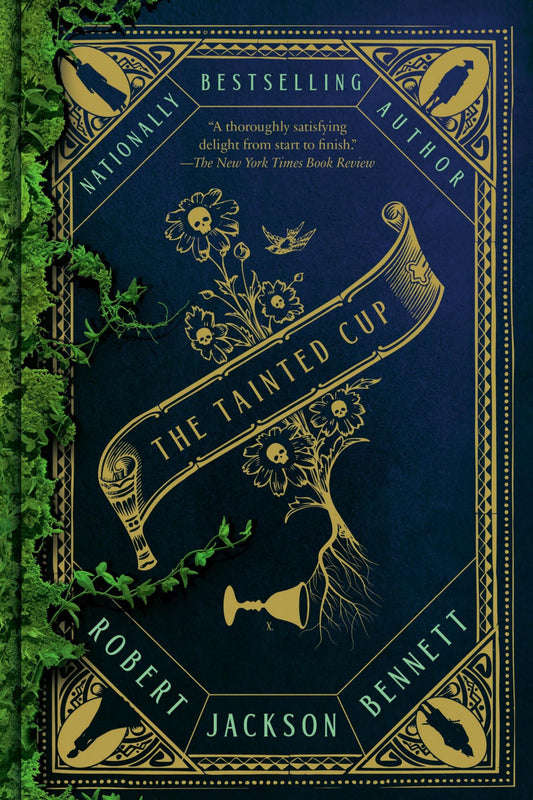 Book cover of The Tainted Cup by Robert Bennett Jackson, featuring a dark navy blue background with ornate gold decorative borders, a rolled banner with the title, floral and skull motifs, and green ivy climbing along the left side.