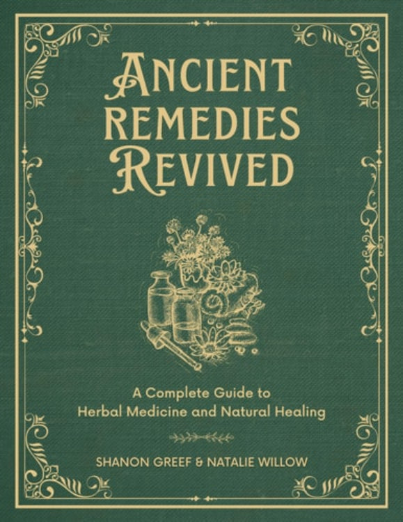 Cover of the book 'Ancient Remedies Revived' featuring title and author names, Shanon Greef and Natalie Willow, with a green background and floral decorations.
