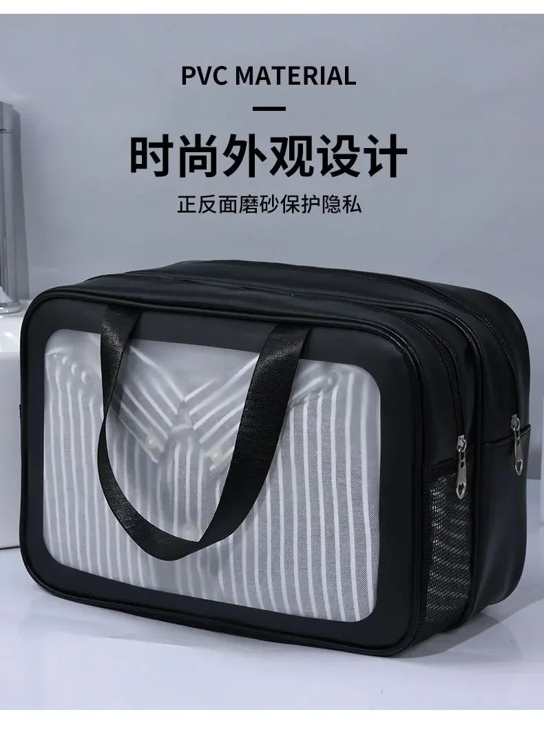 Black PVC material bag with transparent front panel on a gray background