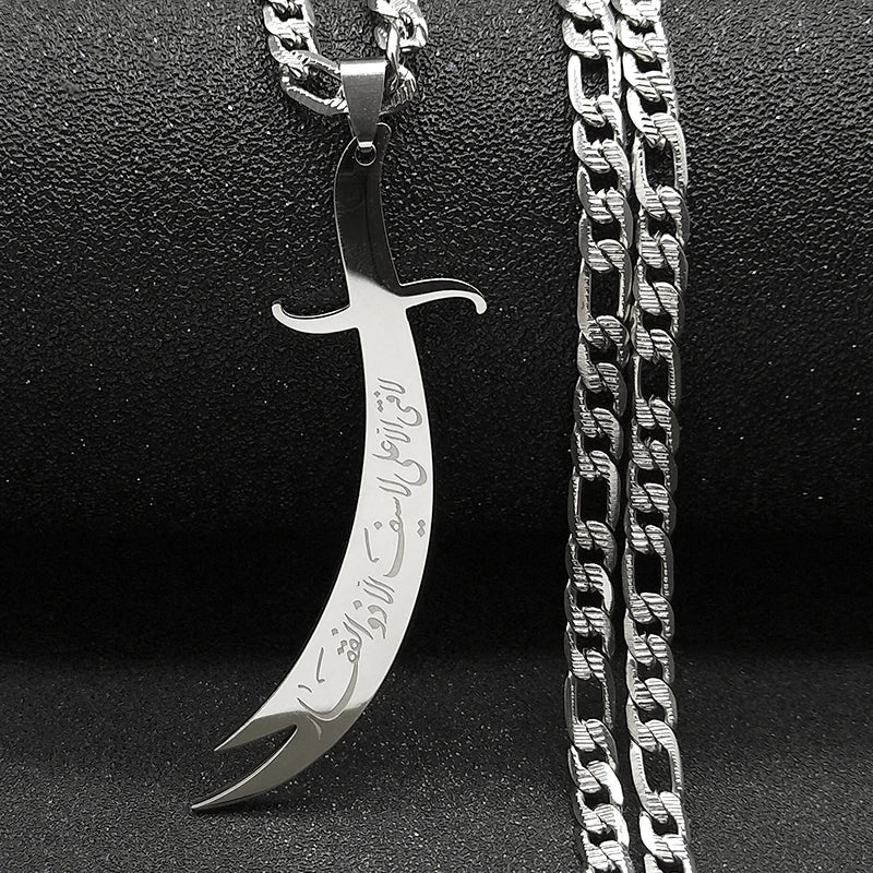 Silver dagger-shaped pendant with chain on a black background