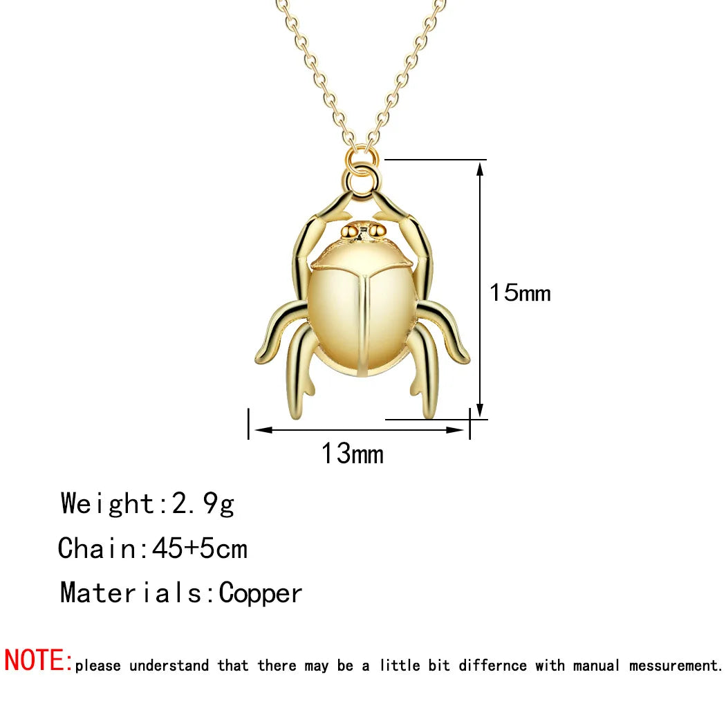 Gold beetle pendant necklace with measurements and material details on a white background