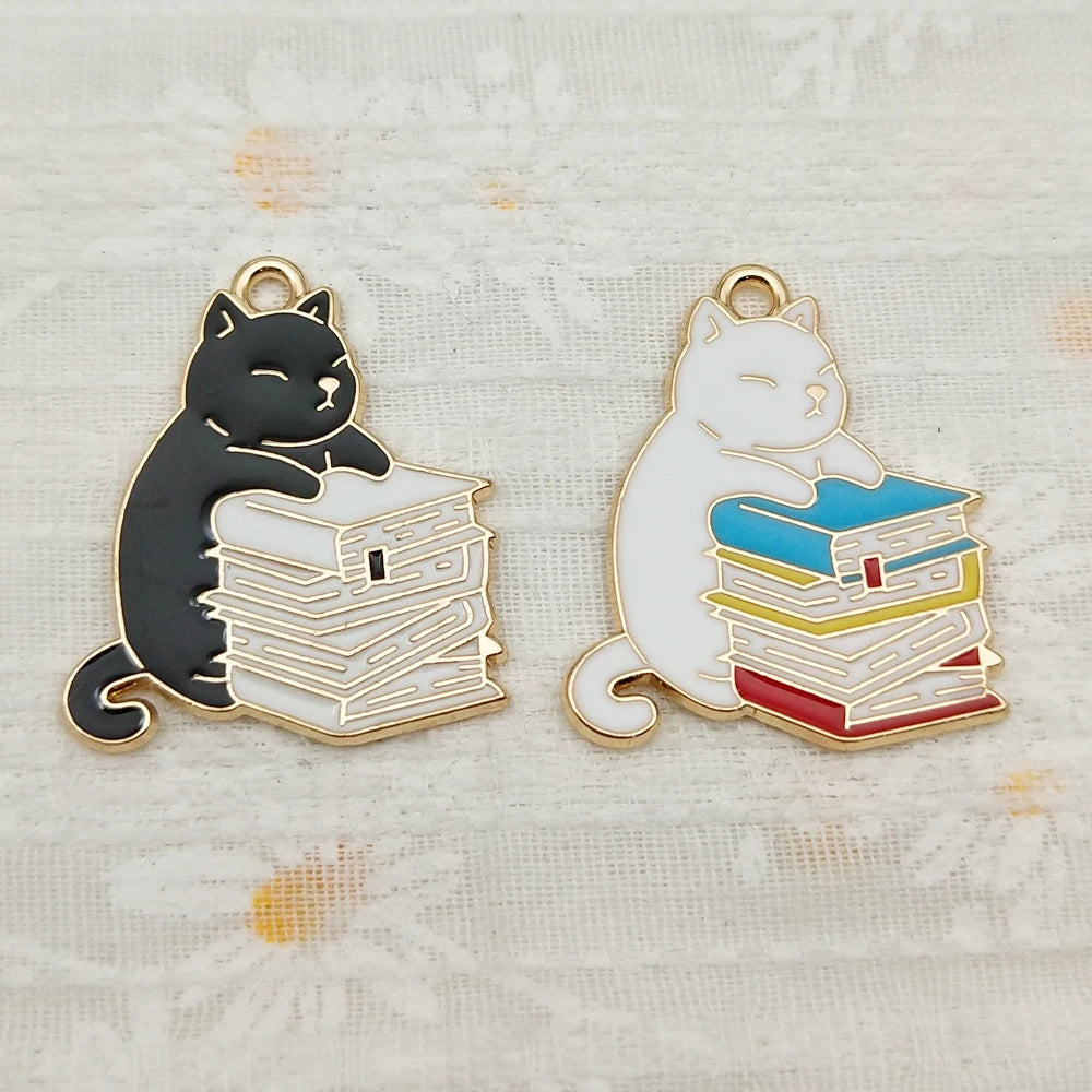 Pendant necklace showing a husky cat hugging a stack of books charm.