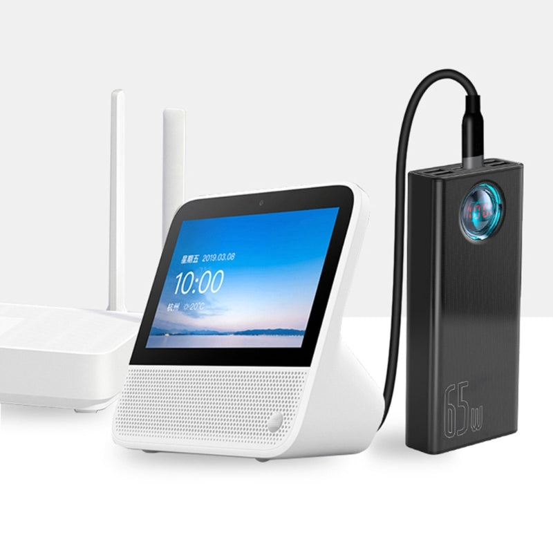 Smart device with screen and a black power adapter on a white background