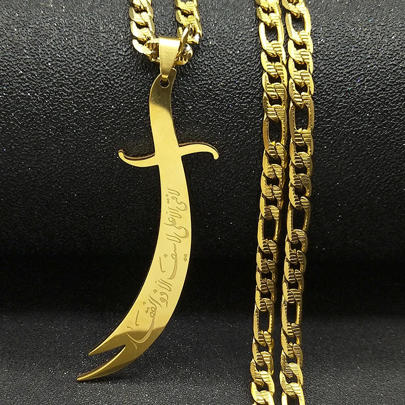 Gold dagger-shaped pendant with chain on a black background