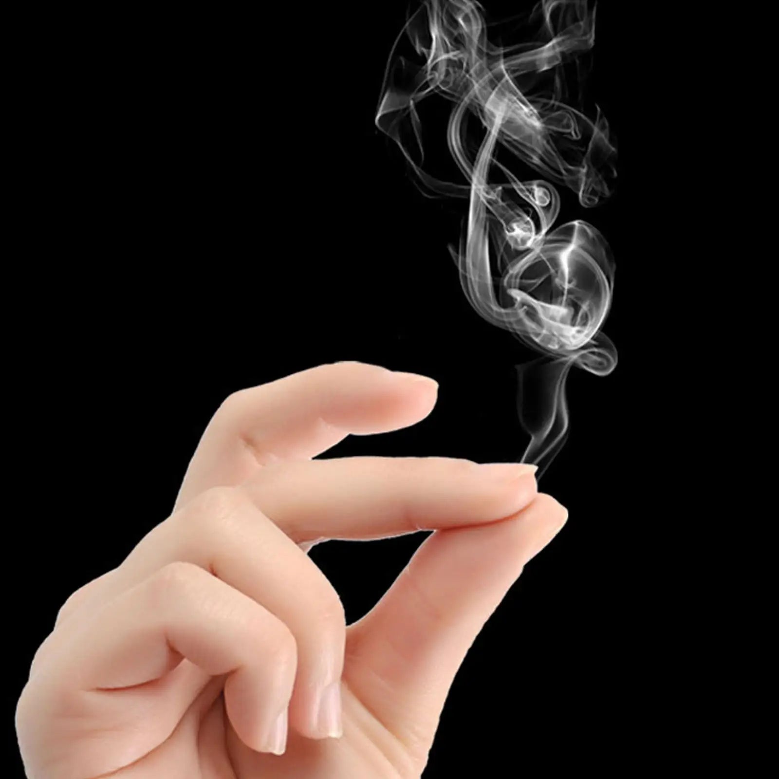 Hand holding a small amount of smoke against a black background
