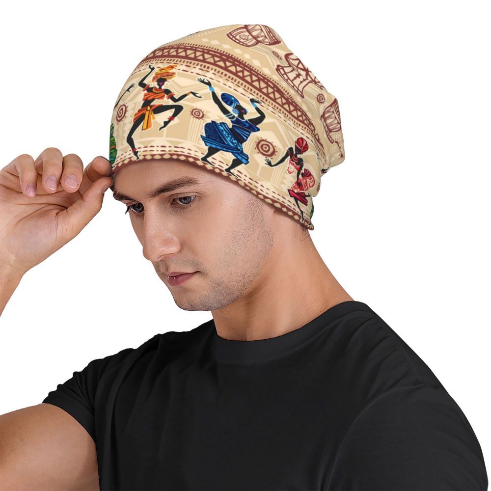 Man wearing a patterned headscarf fitted beanie with a plain background skullcap