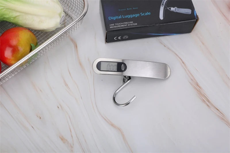 The AirportPRO digital hanging luggage scale with LCD screen being used in kitchen for food measurement and portion weight.