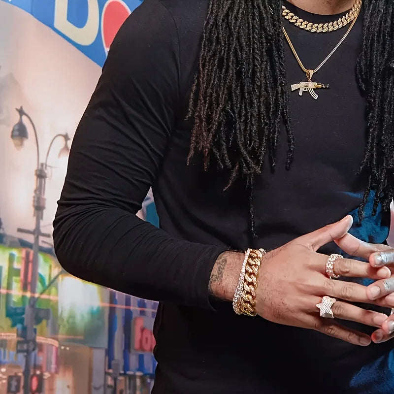 Person wearing AK47 Bust-Down chain and other gold jewelry with a blurred cityscape background