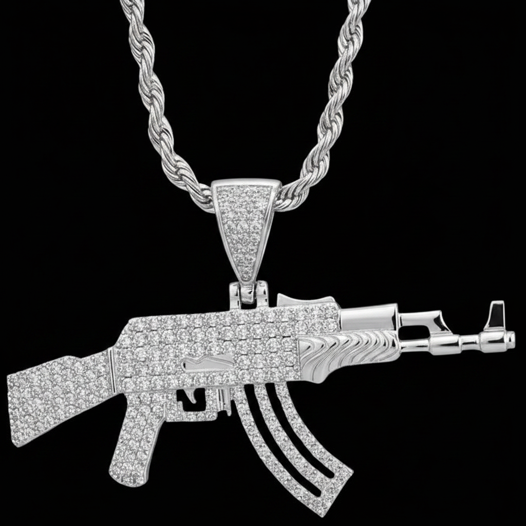 Silver AK47 gun-shaped pendant on a black background