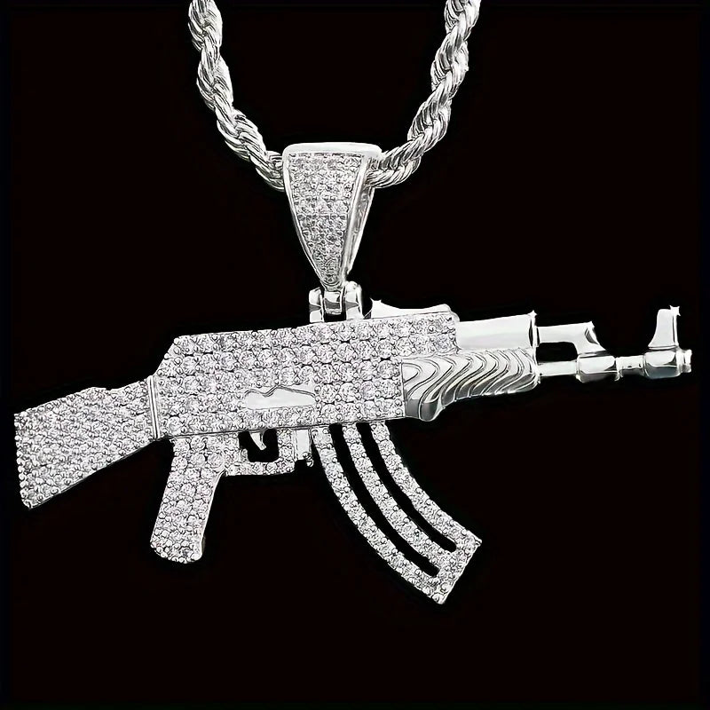 Silver AK47 gun-shaped pendant on a black background