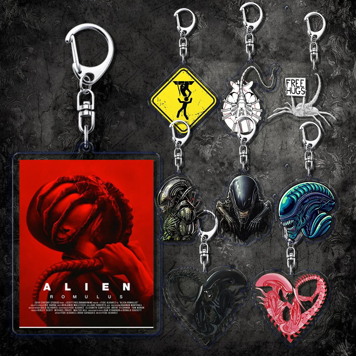 Collection of Alien-themed keychains and a movie poster on a dark background