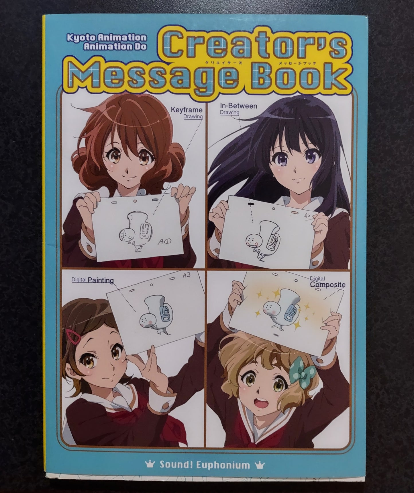 Cover of 'Creator's Message Book' by Kyoto Animations, with illustrations of animated characters holding paper sheets.