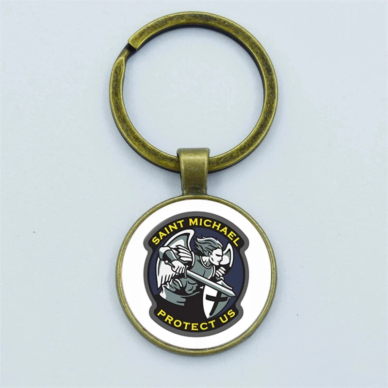 Keychain with Saint Michael design on a light gray background