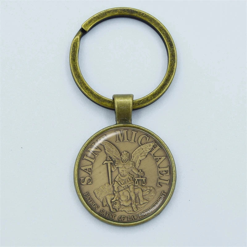Bronze keychain with Saint Michael design on a white background