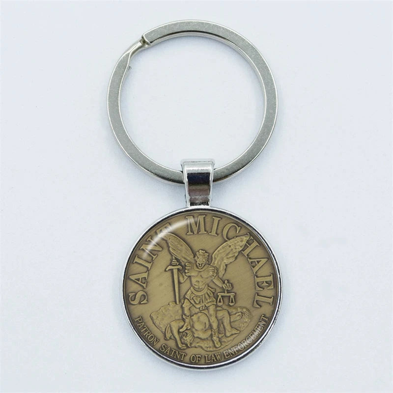 Keychain with Saint Michael emblem on a white background