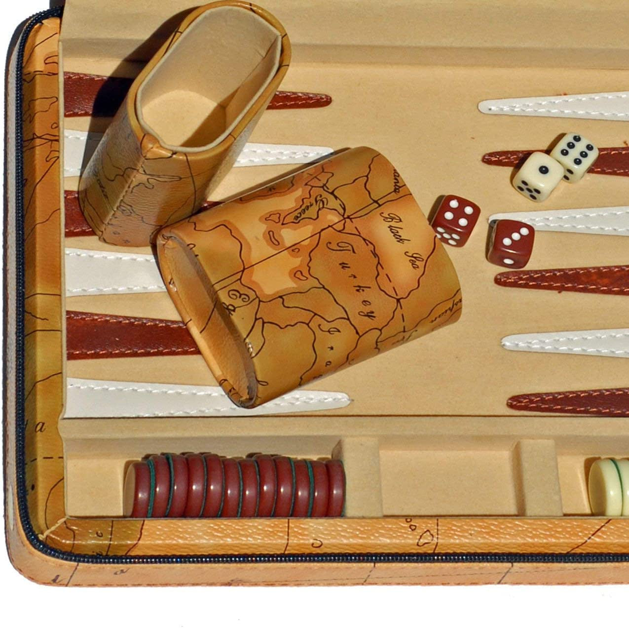 Backgammon set pictured with travel containers, dice and pieces on game board.