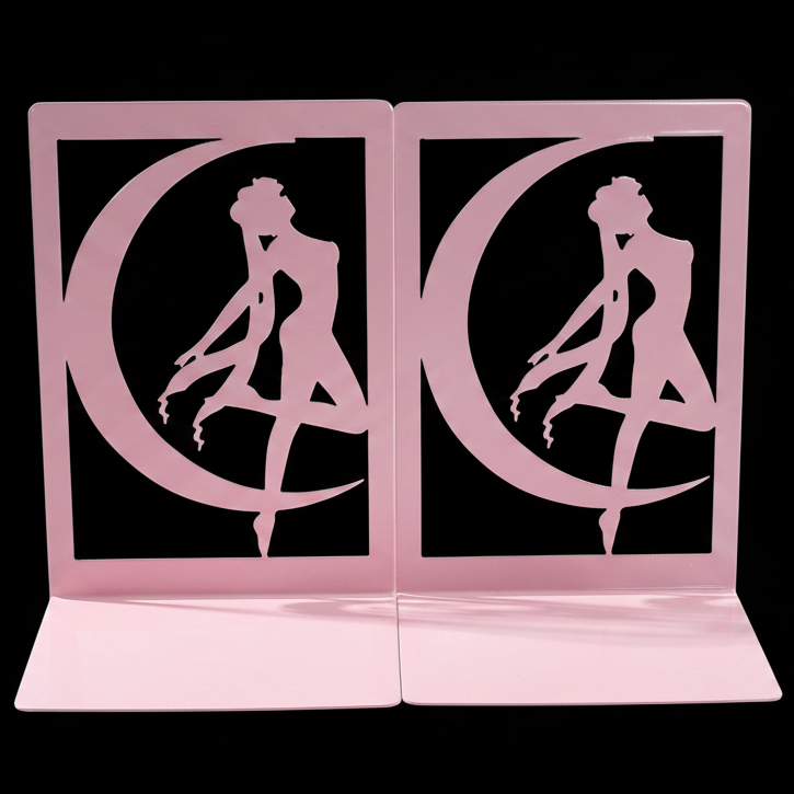 Pink bookends with a silhouette of a woman and crescent moon design on a black background