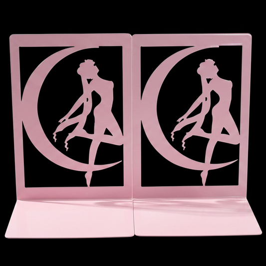 Pink bookends with a silhouette of a woman and crescent moon design on a black background