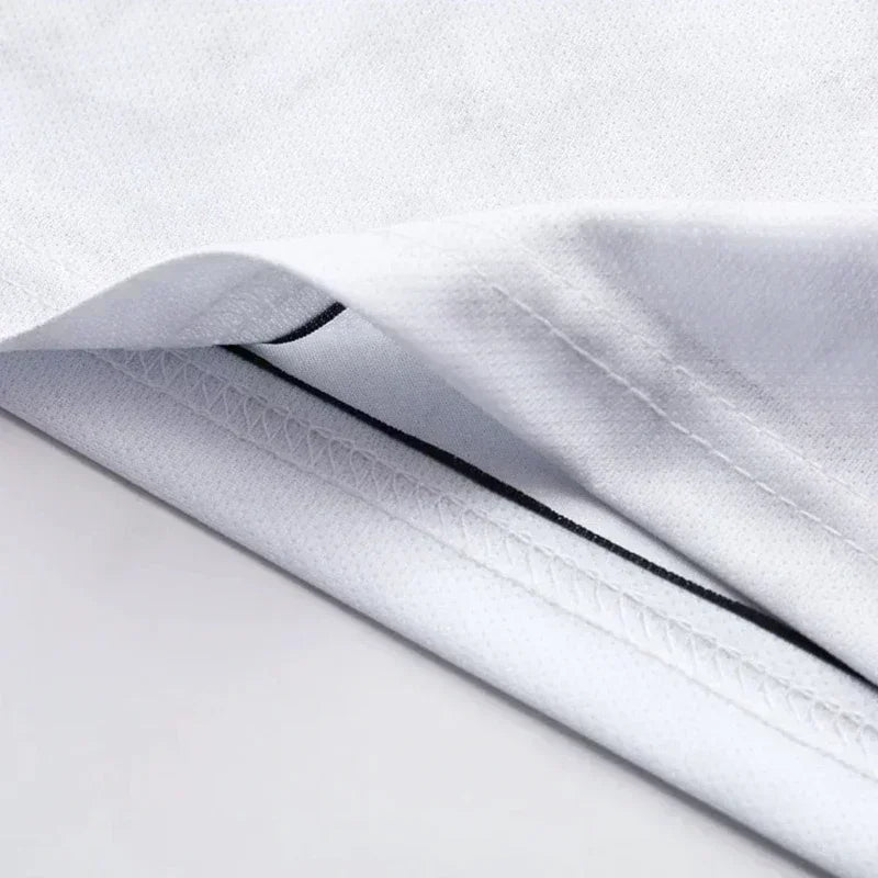 Close-up of a textured fabric with a subtle pattern on a light gray background