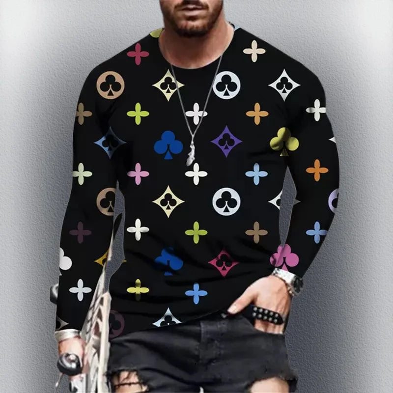 Person wearing a black sweater with colorful patterns against a gray background