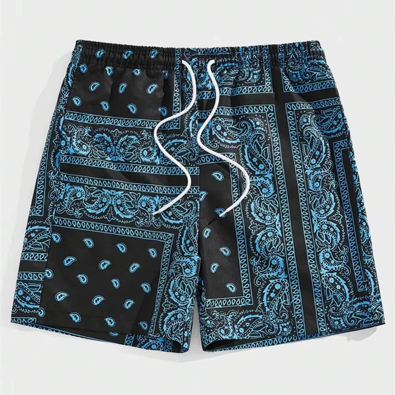 Blue and black patterned shorts with a drawstring on a white background