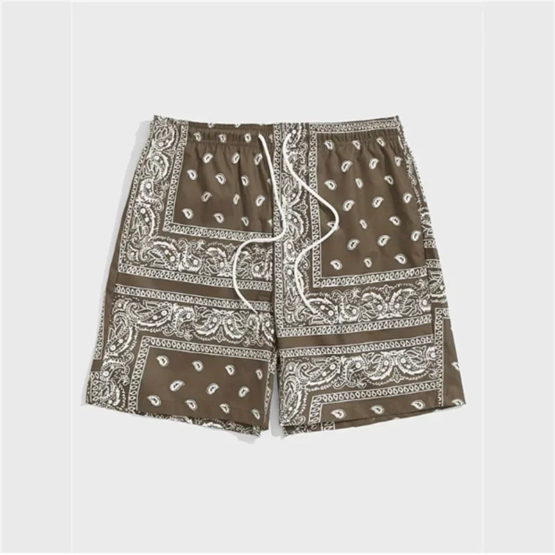 Brown shorts with white bandana pattern on a light gray background