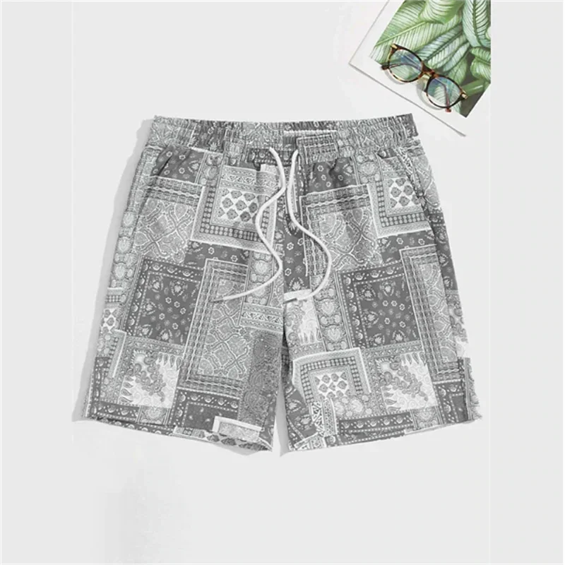Grey Paisley patterned shorts on a white background