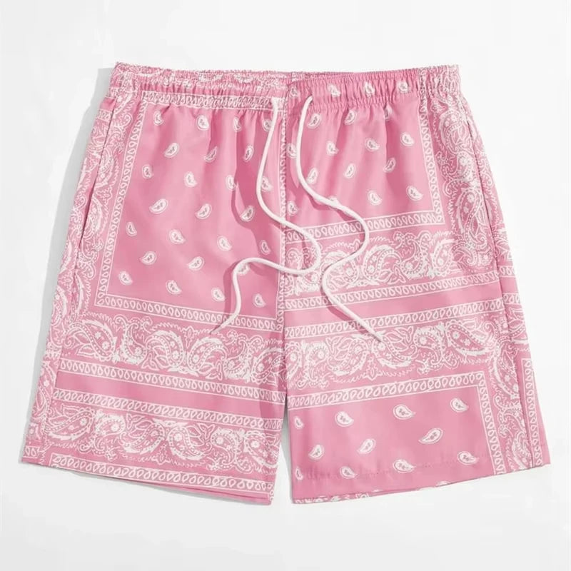 Pink shorts with white paisley pattern on a white background
