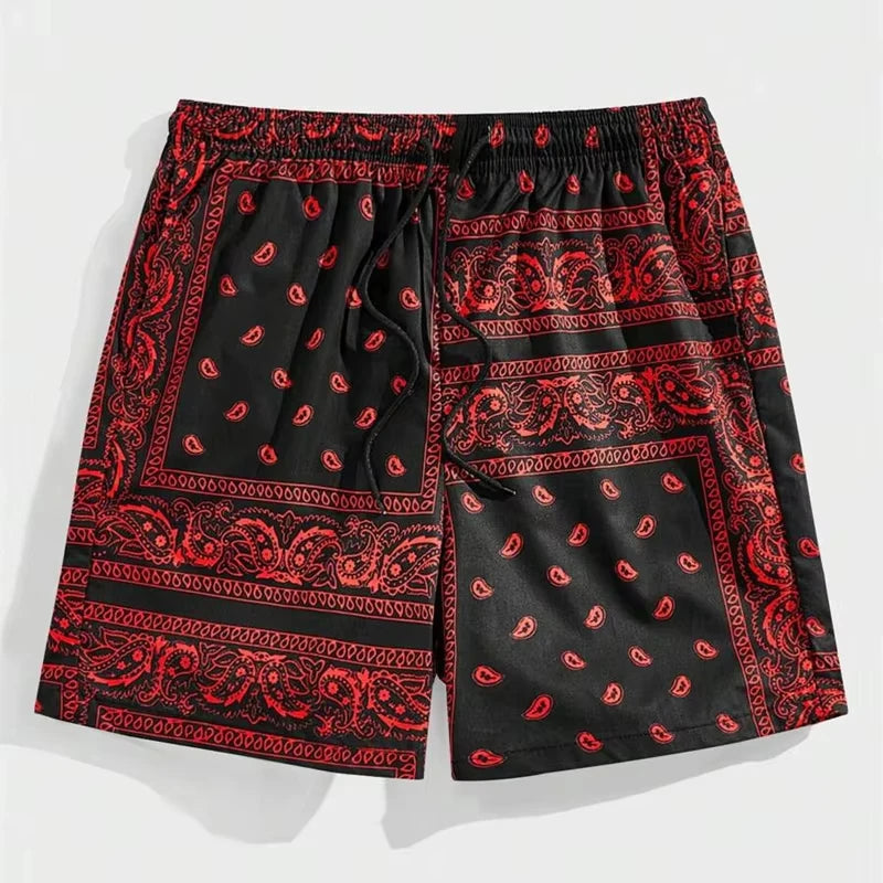 Black shorts with red paisley pattern on a white background