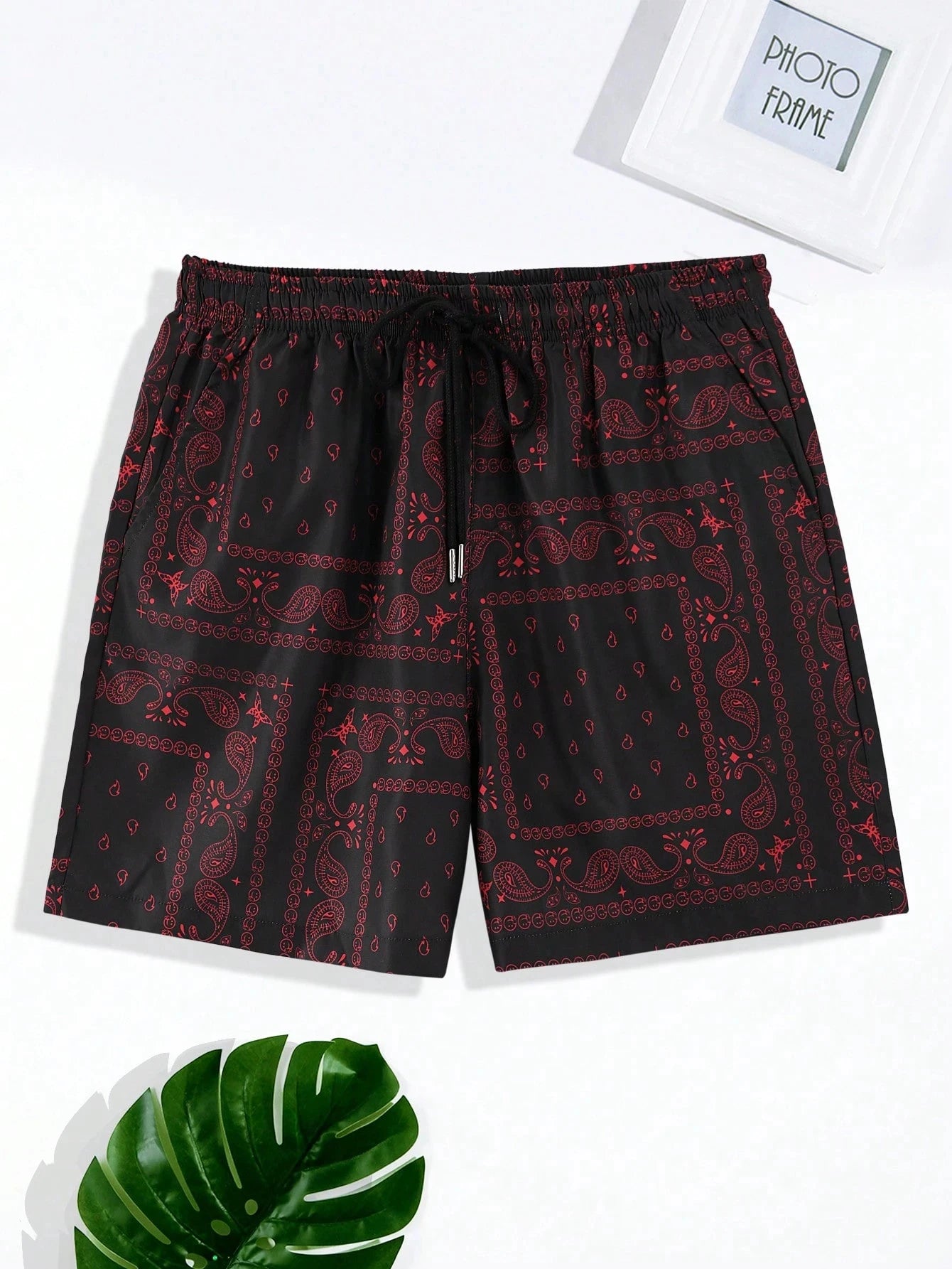 Black shorts with red pattern on a white background