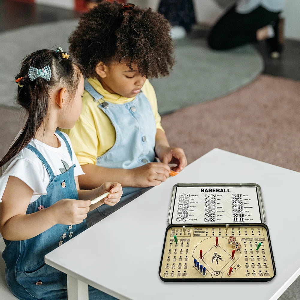 Two children playing baseball board game on a table.